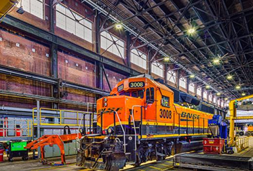 Train inside maintenance facility highlighting masonry work.