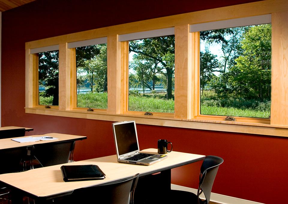 Education classroom with a window view of the woods.