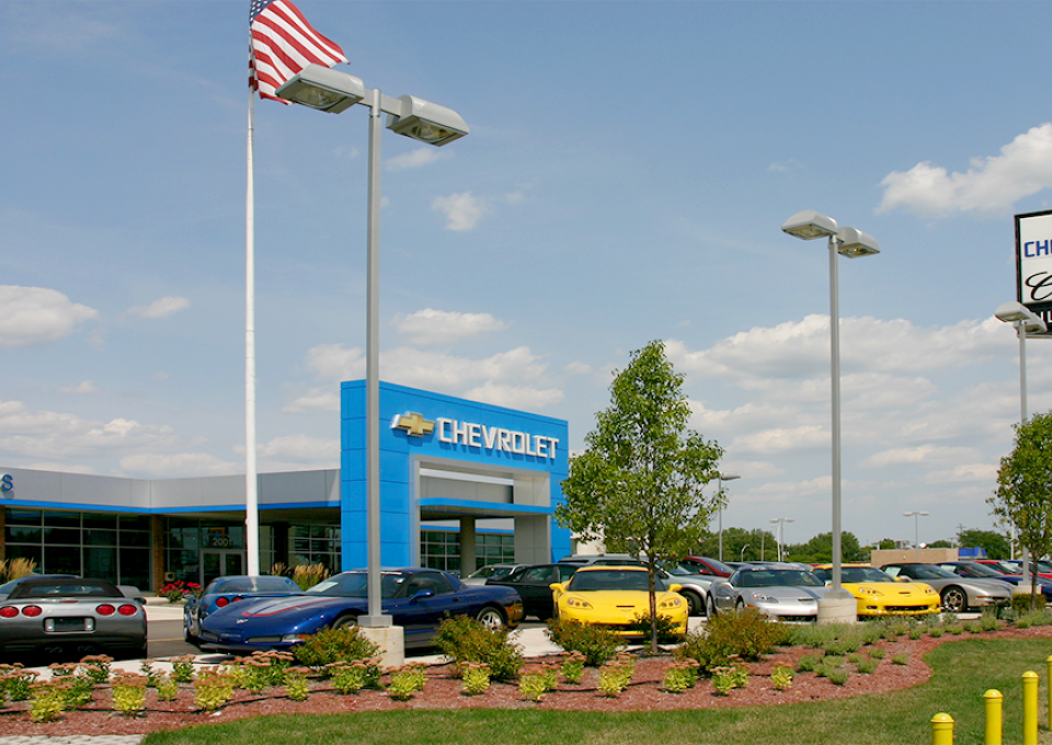 Chevrolet cars parked at the exterior of the building with a blue square archway