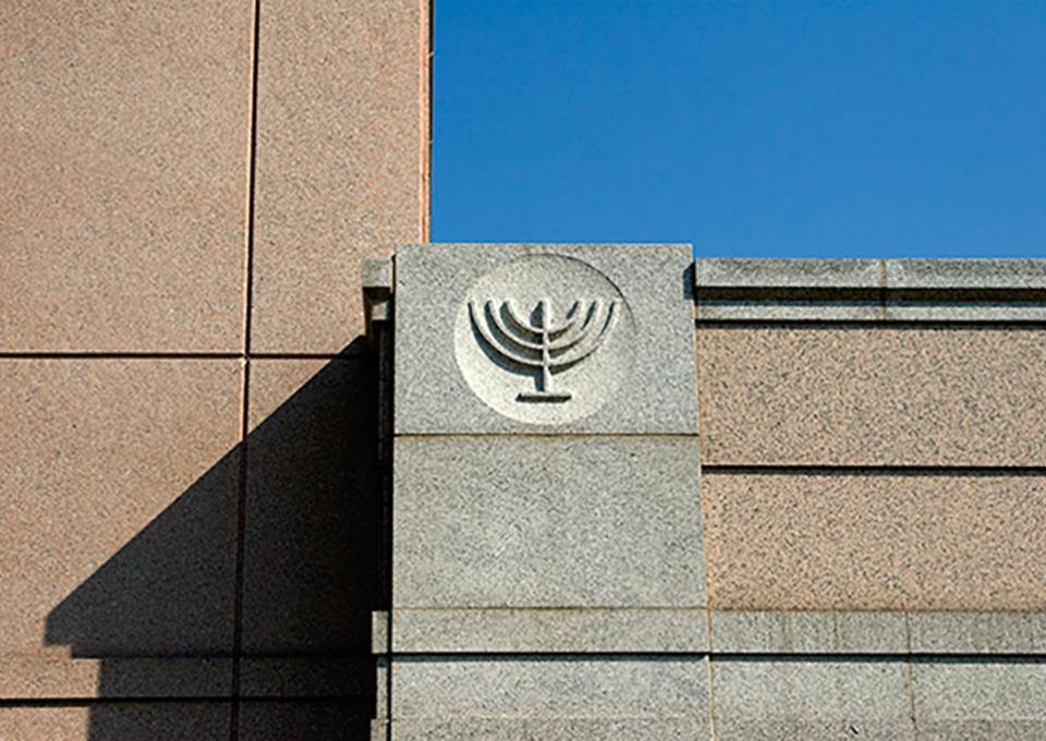 Precast concrete with menorah engraved in stone.