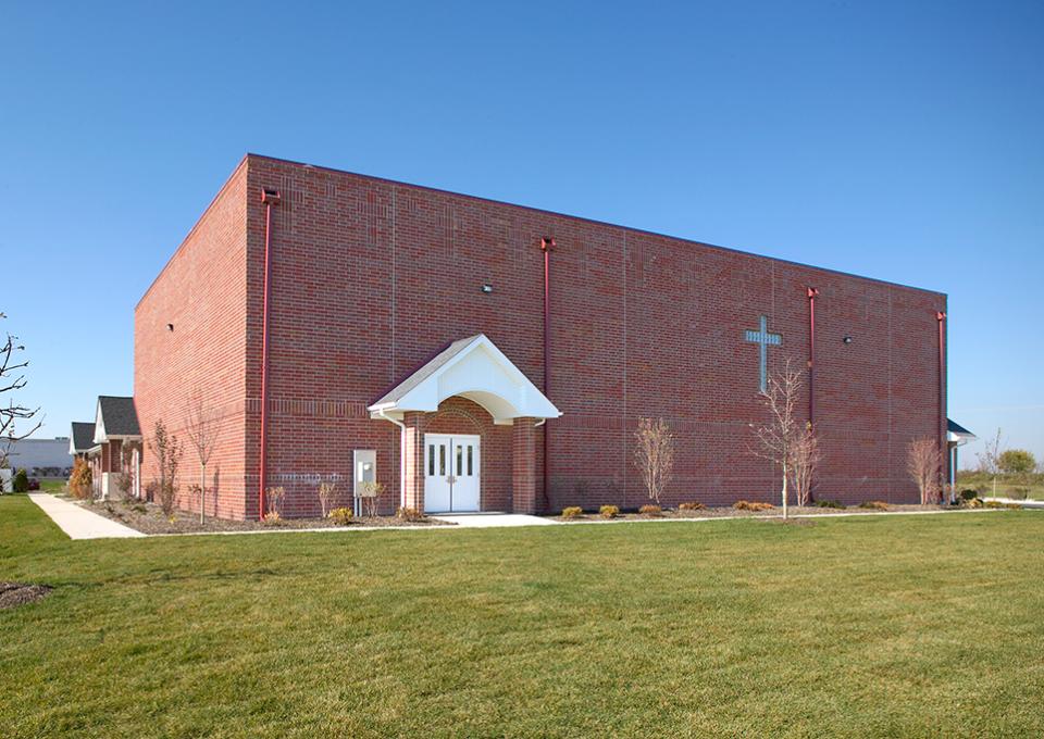 The red brick exterior of the gymnasium addition.