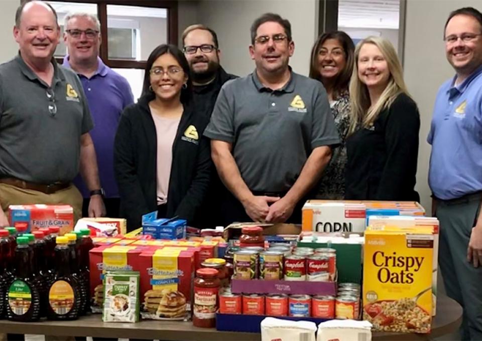 GAC staff with food donations
