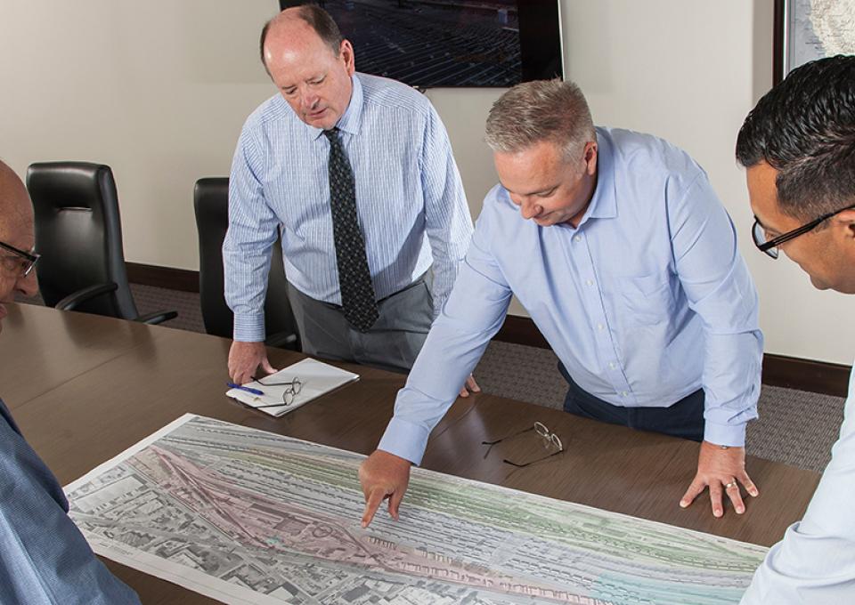 GAC management looking over plan