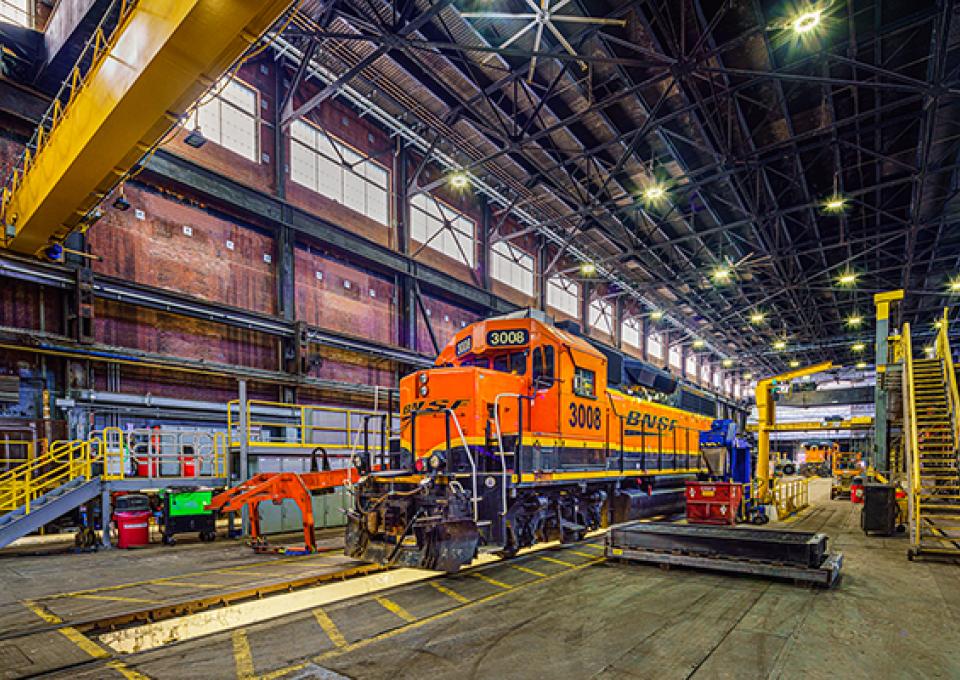 Train inside maintenance facility highlighting masonry work.