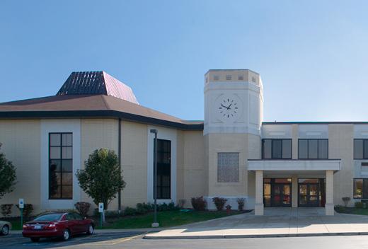Yellow brick exterior with a clock tower.