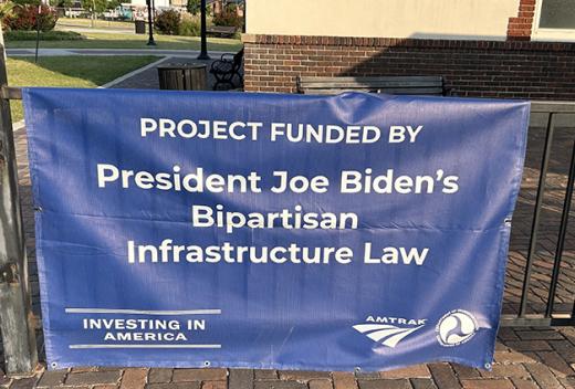 Fence with President Joe Biden Bipartisan Infrastructure Law sign