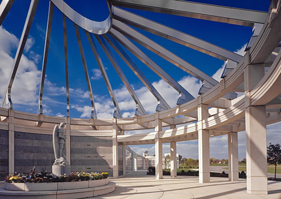 Circular mausoleum dome with radial stainless steel spokes.
