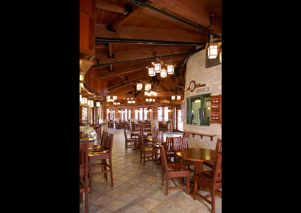 Interior of passenger station with wooden beam ceiling.