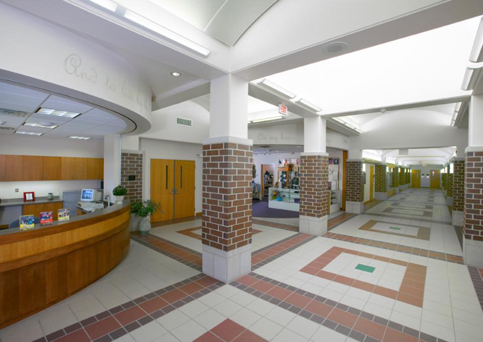 Administration front desk, hallway with brick pillars