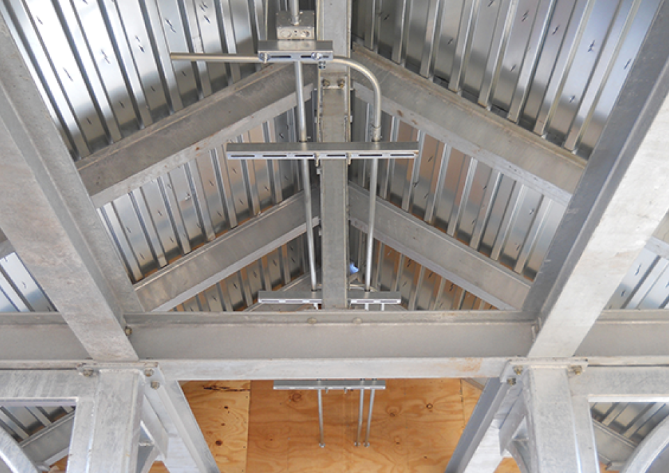 Detail of metal roof as seen from the interior of commuter station.