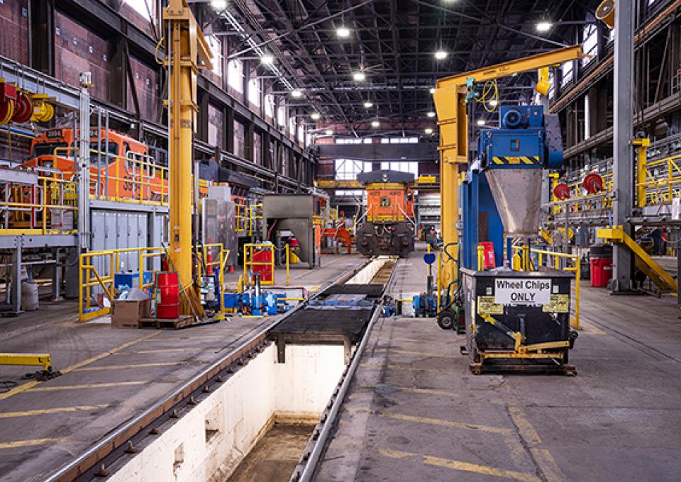 Interior maintenance building with a view of wheel truing pit and drop table.