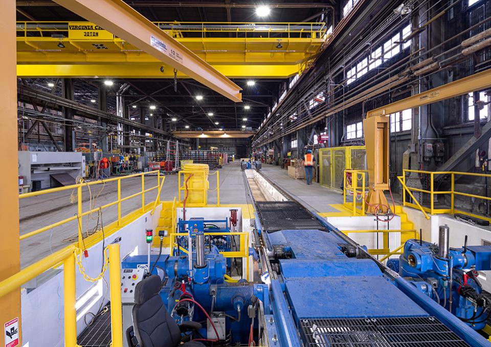 Maintenance building interior with view of blue wheel truing machine.