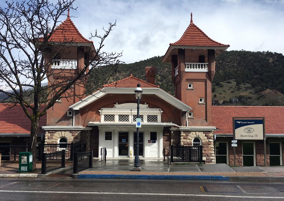 Passenger station with highlighting entrance flanked by two towers.